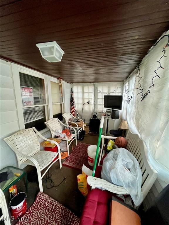 interior space featuring wooden ceiling