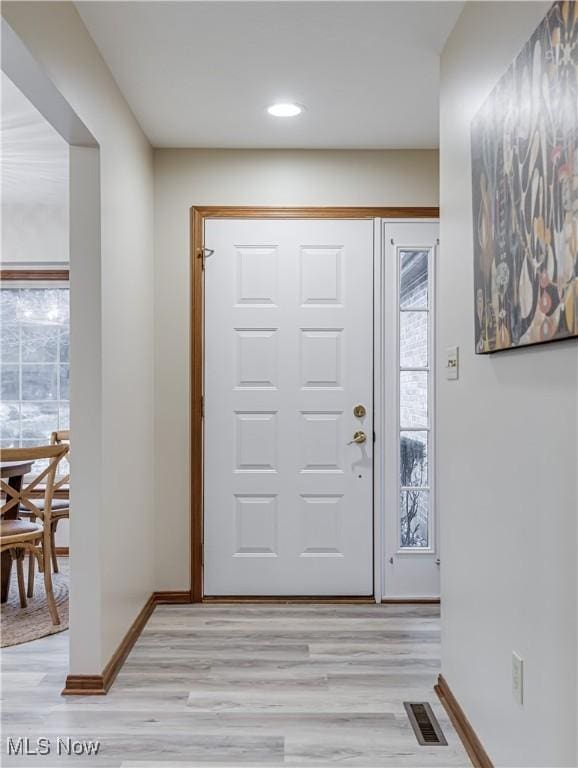 foyer entrance featuring light wood-type flooring