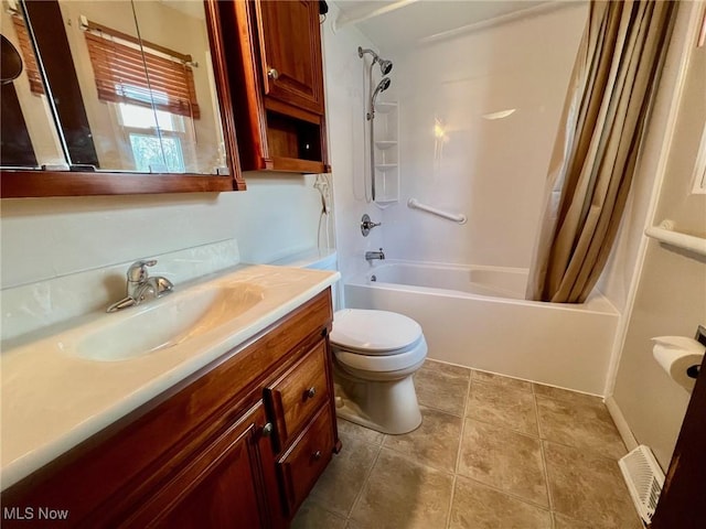 full bathroom with vanity, tile patterned floors, toilet, and shower / bath combo with shower curtain