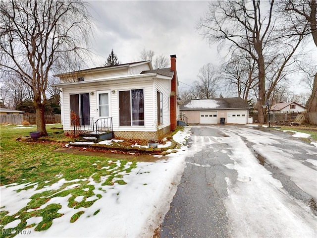 view of front of home with an outbuilding and a garage