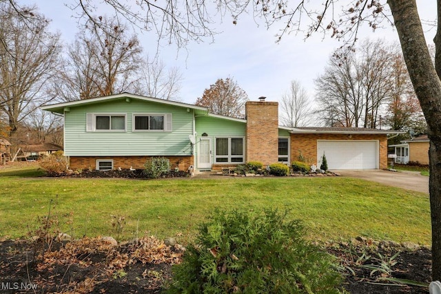 view of front of home featuring a garage and a front lawn