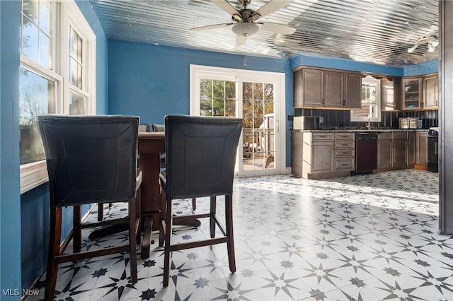 dining room with wood ceiling and ceiling fan