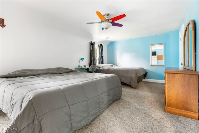 bedroom featuring light colored carpet and ceiling fan