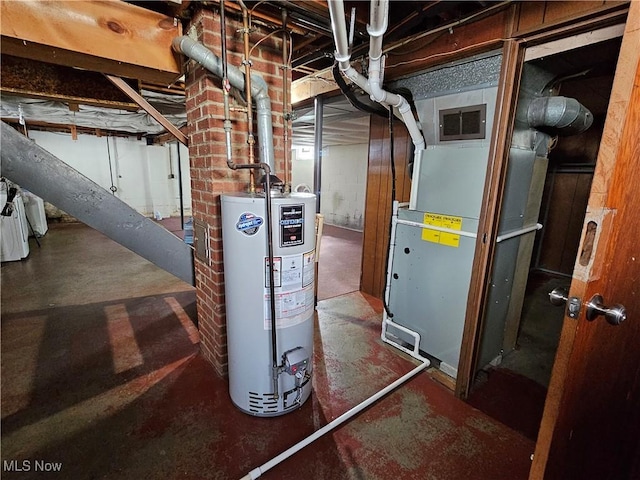 utility room with heating unit and gas water heater