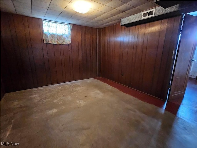 basement with wooden walls