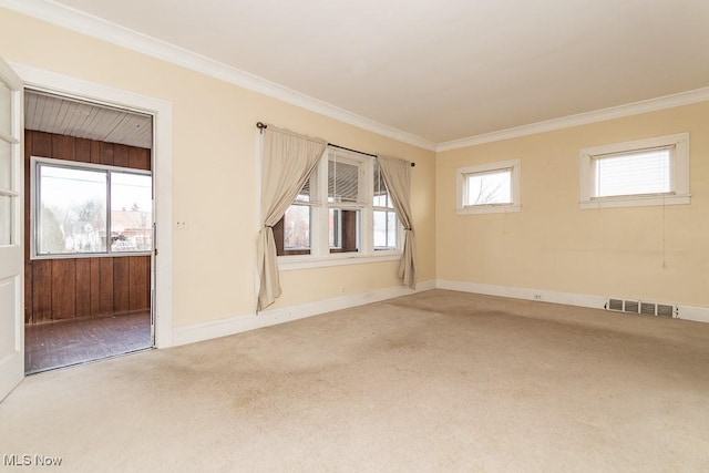 carpeted empty room with ornamental molding