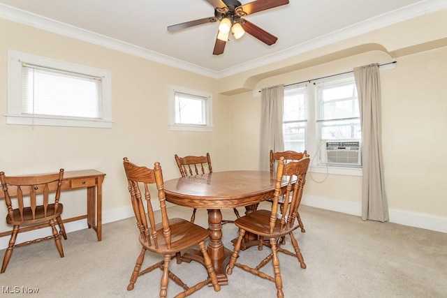 dining space featuring cooling unit, ceiling fan, crown molding, and light carpet