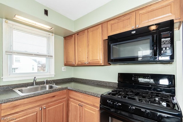 kitchen with sink and black appliances