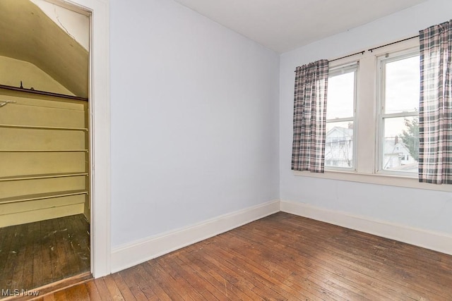 empty room featuring hardwood / wood-style flooring