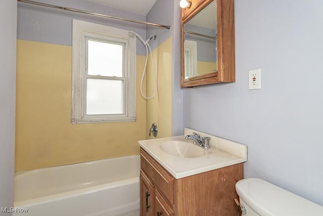 full bathroom featuring vanity, shower / washtub combination, and toilet