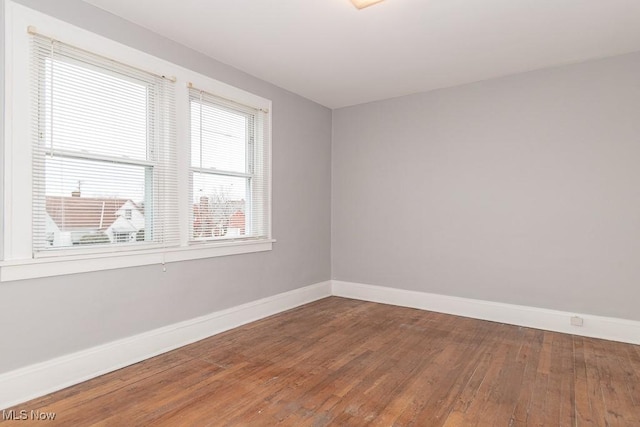 unfurnished room featuring wood-type flooring