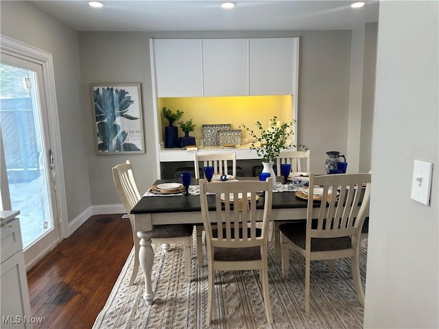 dining room featuring recessed lighting, dark wood finished floors, and baseboards