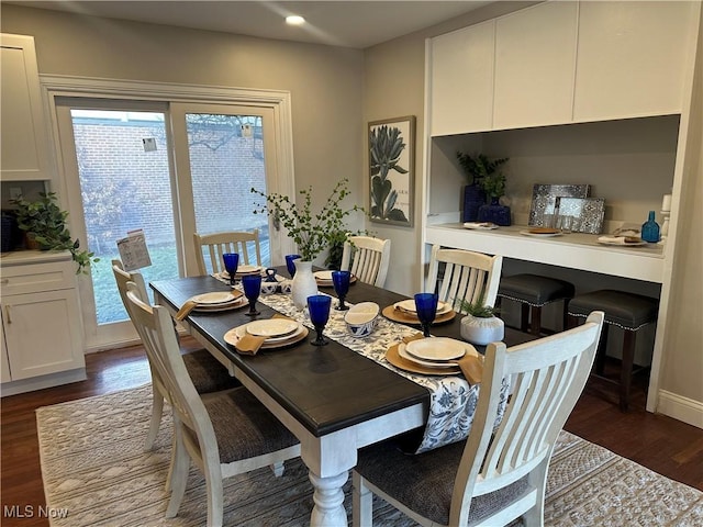 dining space with baseboards, dark wood-type flooring, and recessed lighting