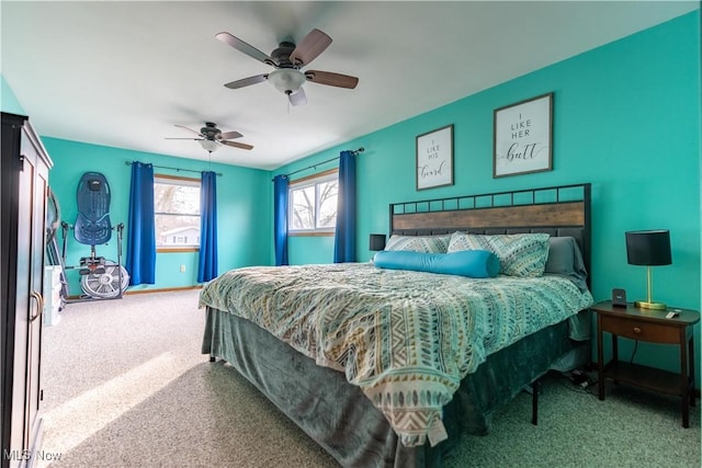 bedroom featuring ceiling fan and carpet