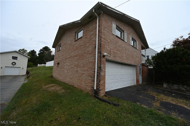 view of property exterior featuring a garage and a lawn