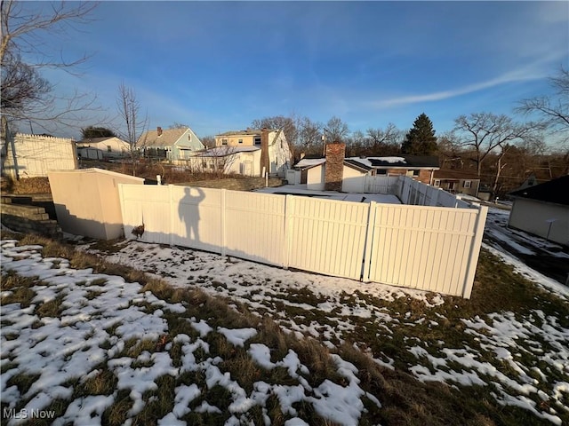 view of yard covered in snow