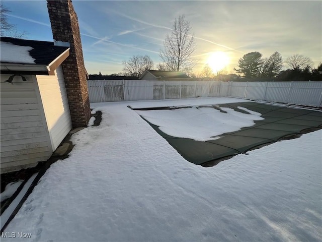 view of pool at dusk