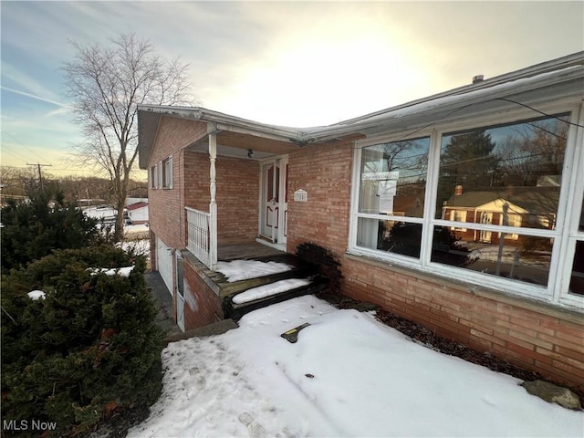 view of snow covered property