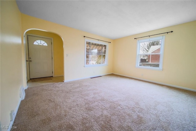 view of carpeted entrance foyer