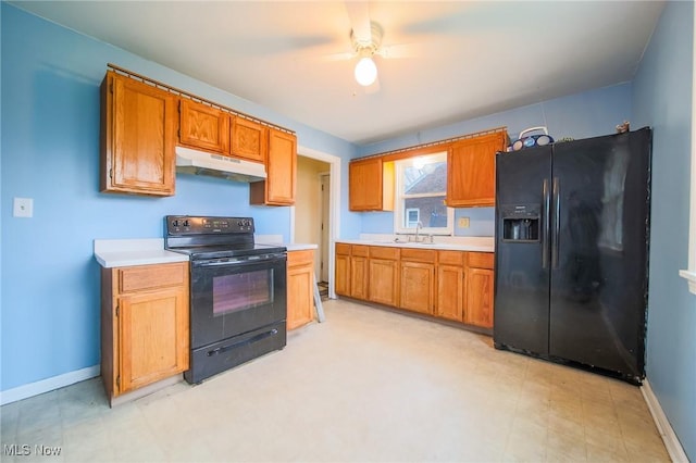 kitchen with sink and black appliances