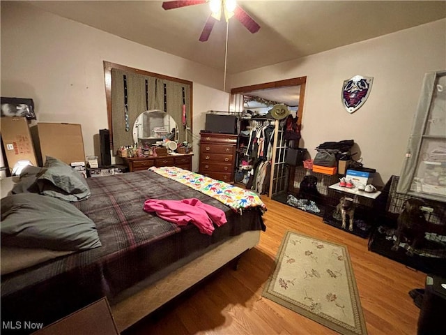 bedroom featuring ceiling fan and wood-type flooring