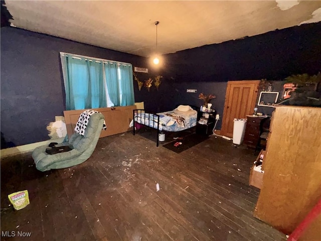 unfurnished bedroom featuring dark hardwood / wood-style flooring