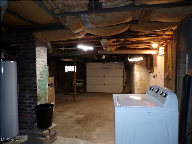 garage featuring gas water heater and washer / dryer