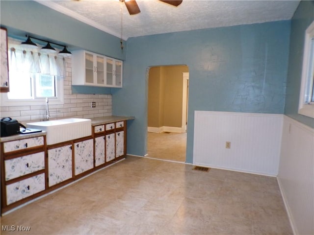 interior space with sink and a textured ceiling