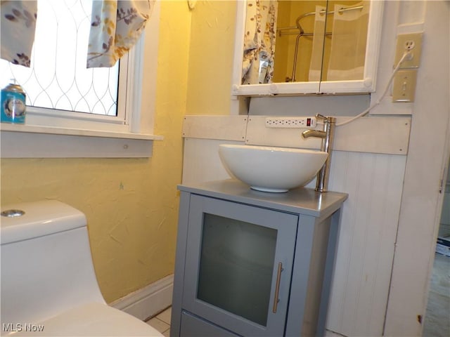 bathroom with vanity and toilet