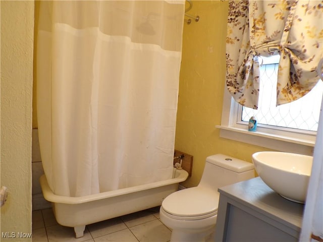 bathroom featuring tile patterned flooring, sink, and toilet