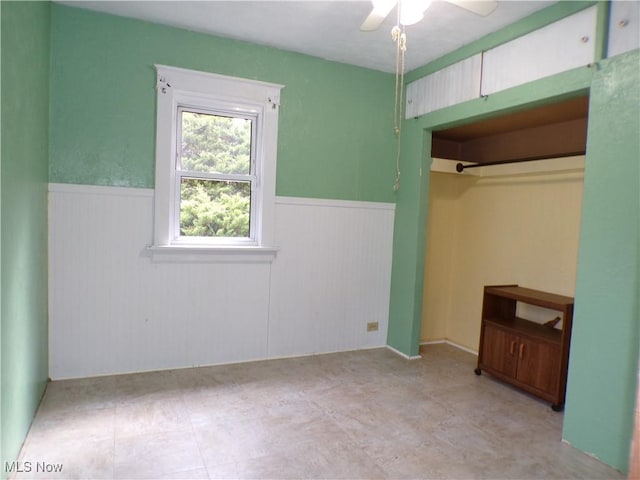 unfurnished bedroom featuring a closet and ceiling fan