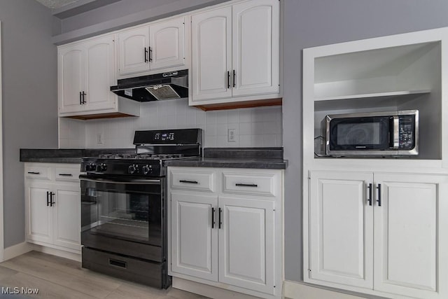 kitchen featuring backsplash, black gas stove, light wood-type flooring, and white cabinets