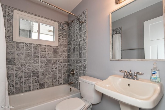 full bathroom featuring shower / tub combo, sink, and toilet