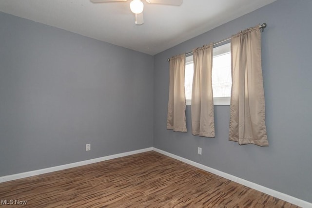 unfurnished room featuring hardwood / wood-style floors and ceiling fan