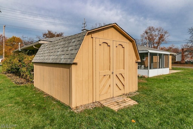 view of outdoor structure with a yard