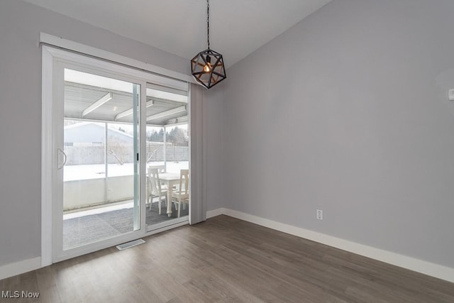 spare room with dark hardwood / wood-style floors