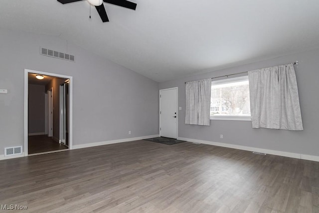 unfurnished living room featuring hardwood / wood-style flooring, ceiling fan, and vaulted ceiling