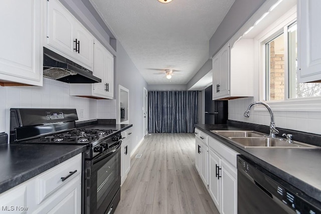 kitchen with sink, white cabinets, ceiling fan, black appliances, and light wood-type flooring