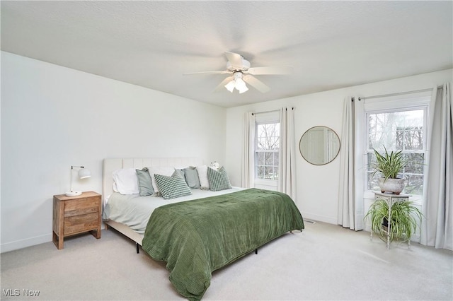 bedroom featuring ceiling fan and carpet flooring