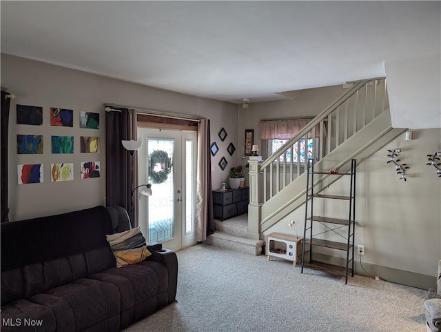 carpeted living room featuring a healthy amount of sunlight