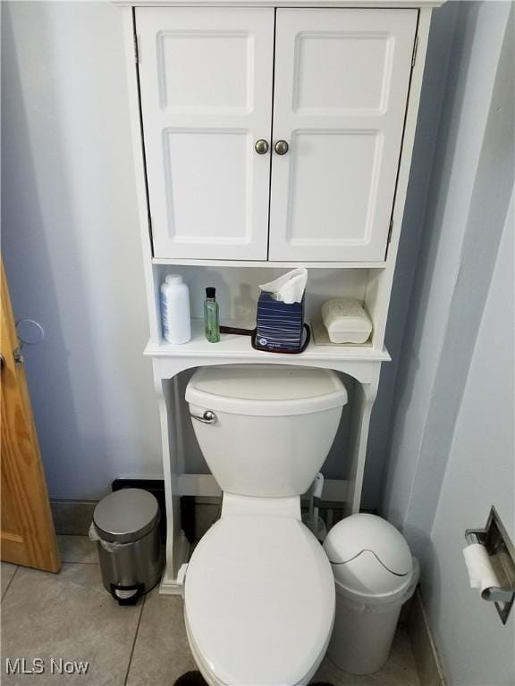 bathroom featuring tile patterned flooring and toilet