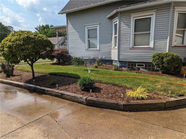 view of home's exterior featuring a lawn