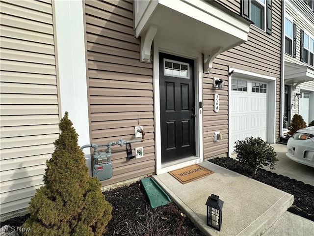 property entrance with a garage