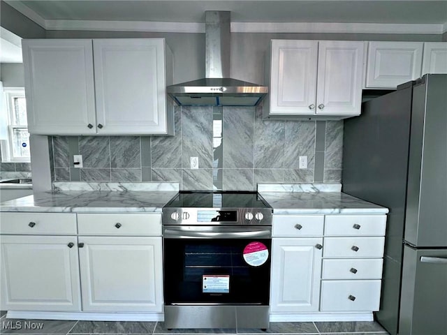 kitchen with white cabinetry, appliances with stainless steel finishes, light stone counters, and wall chimney exhaust hood