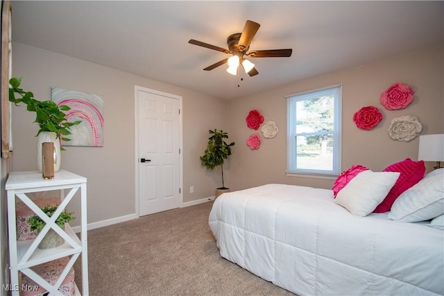 bedroom with light carpet and ceiling fan