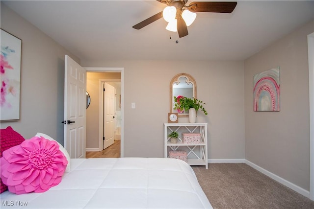 bedroom with light carpet and ceiling fan