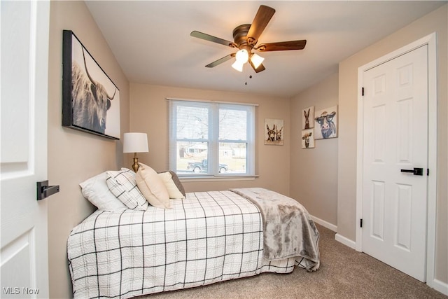 carpeted bedroom featuring ceiling fan