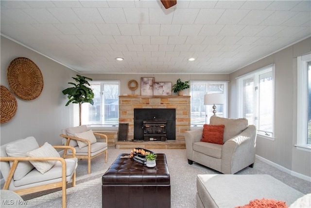 living room with ornamental molding and carpet flooring