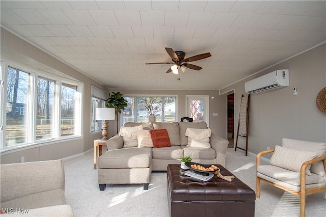 living room with an AC wall unit, plenty of natural light, light carpet, and ceiling fan