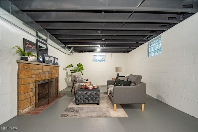 basement with a stone fireplace